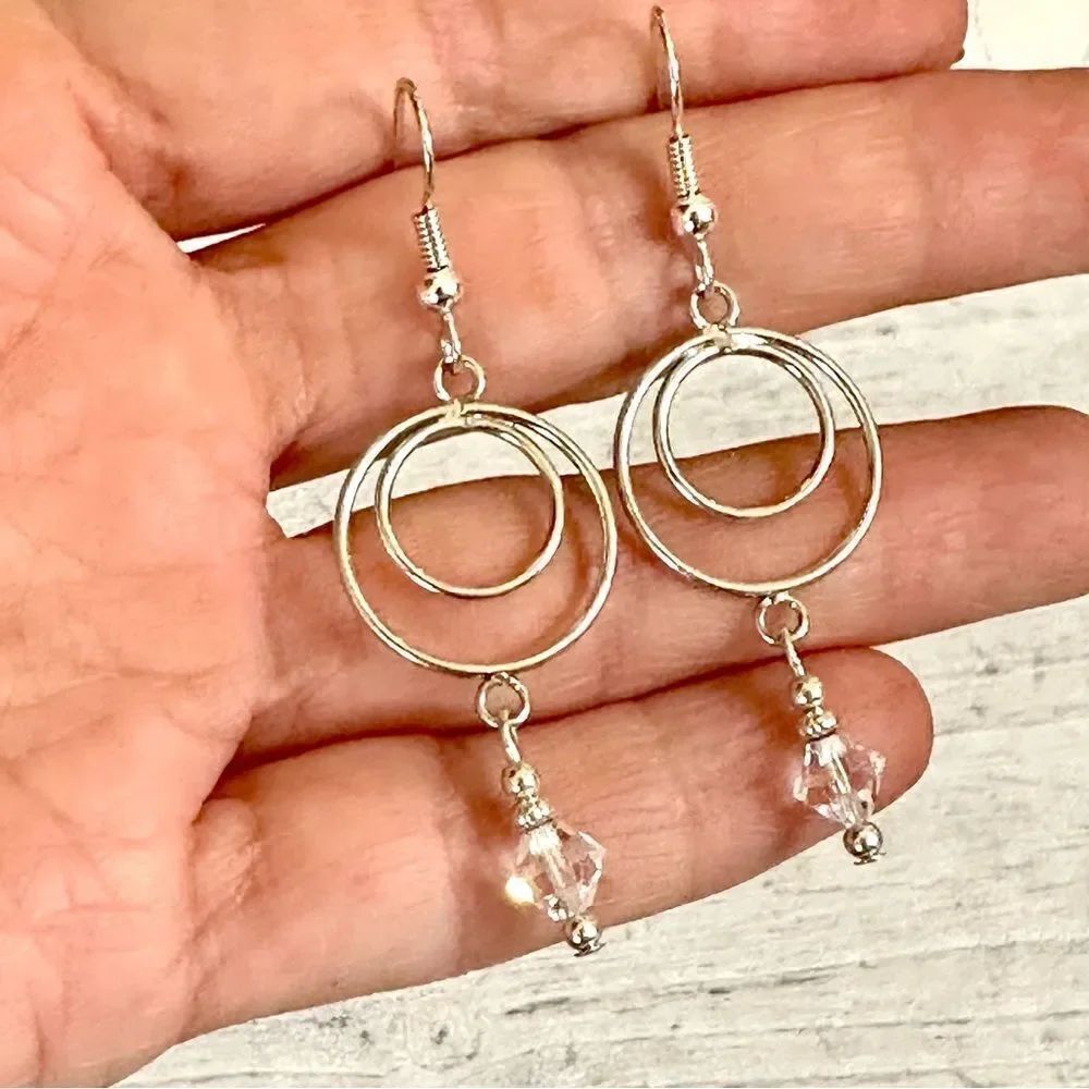 Silver tone crystal dangle earrings